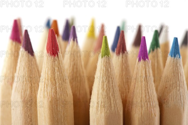 Many wooden color pencils isolated over white