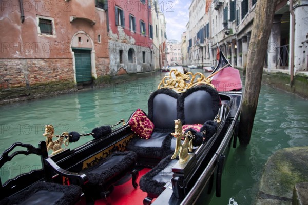 Gondola in Venice channel at the pier