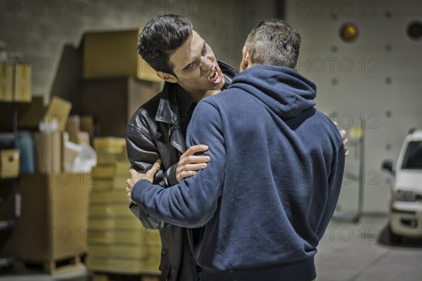 Close up Hungry Young Male Vampire with Scary Facial Expression Bites the Neck While Holding a Man