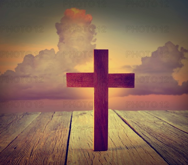 Christian wood cross on sunset sky wooden made