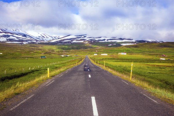 Summer tour in the Nordic countries. The concept of extreme northern tourism. The Iceland highway in Tundra
