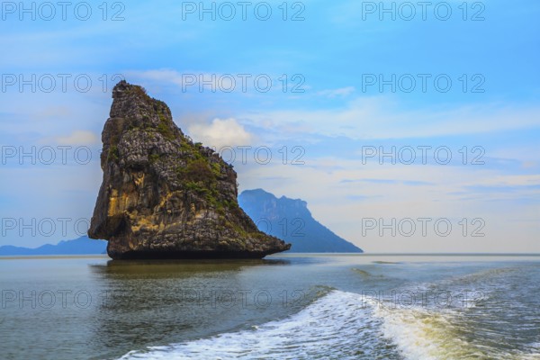 Island Sail in the Andaman Sea. Fantastic beauty island-rock in the southern seas. The photo was taken from a fast sailing boat