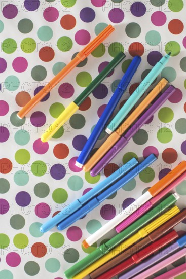 Pens on colorful circles background