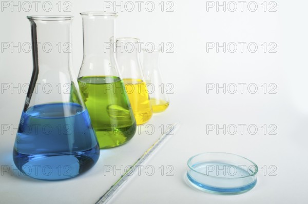 Laboratory glassware equipment. Laboratory beakers filled with colored liquid substances