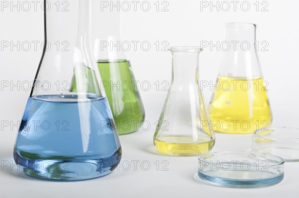 Laboratory glassware equipment. Laboratory beakers filled with colored liquid substances