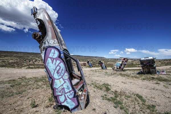 Scrap cars decorated with graffiti in the Carforest of Goldfield, Nevada, USA, North America
