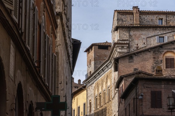 Old residential houses somewhere in the streets of the old medieval Siena, Italy, Europe