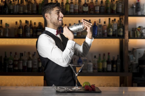 Cool professional bartender making a cocktail, shaking a cocktail shaker. Authentic barman making alcohol beverages in modern bar. High quality photo