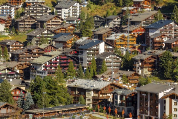 Zermatt, Switzerland, October 7, 2019: Town aerial view in famous swiss ski resort, colorful traditional houses, Swiss Alps mountains, Europe