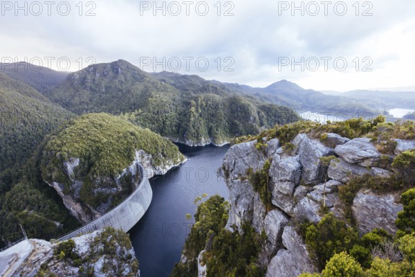 View of the Gordon Dam on a cool summer's day. It is a unique double curvature concrete arch dam with a spillway across the Gordon River near Strathgordon, South West Tasmania, Australia, Oceania