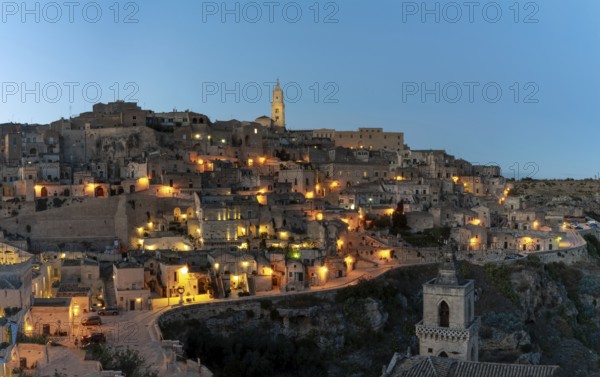 Matera, Italy, 26 November, 2023: view of the old town of Matera after sunset with the lights coming onMatera, Italy, 26 November, 2023:, Europe