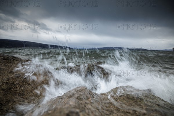 Stormy sea with powerful waves crashing against rocky shore, harbour, Mittelzell, Reichenau, Lake Constance, Baden-Württemberg, Germany, Europe