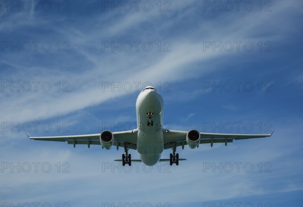 Passenger airplane in the clouds before landing