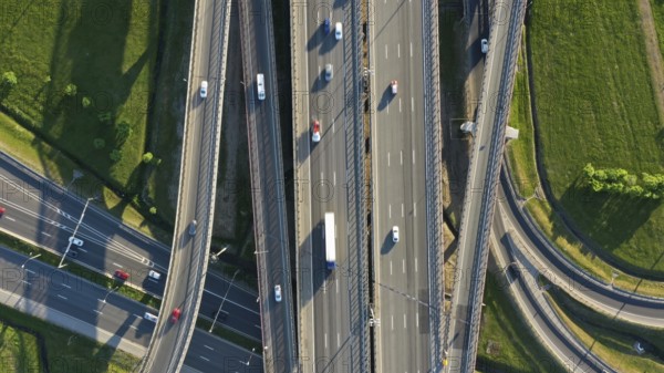 Aerial top view of lot of cars on modern road junction