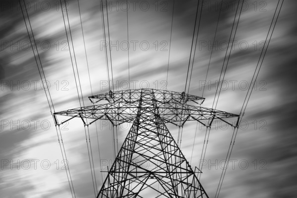 Details of a metallic structure of a high voltage electricity tower holding transmission wires to transfer electrical energy