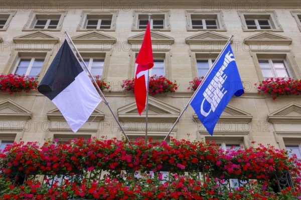 City Hall with Flag and Flowers in a Sunny Summer Day in City of Fribourg, Canton Fribourg, Switzerland, Europe