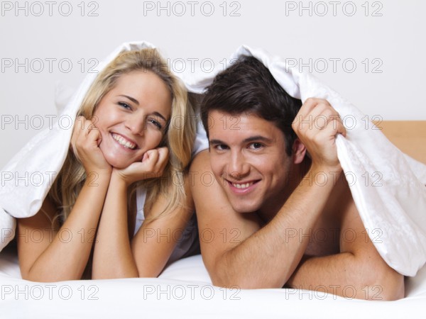 Couple has fun in bed. Laughter, joy and eroticism in the bedroom, Couple has fun in bed. Laughter, joy and eroticism in the bedroom Austria