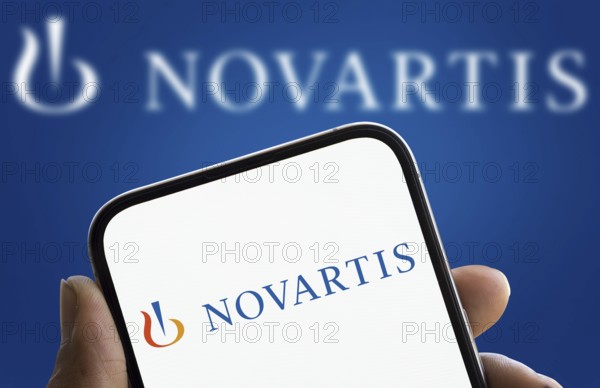 Novartis logo is displayed on smartphone. Novartis AG is a Swiss multinational pharmaceutical corporation