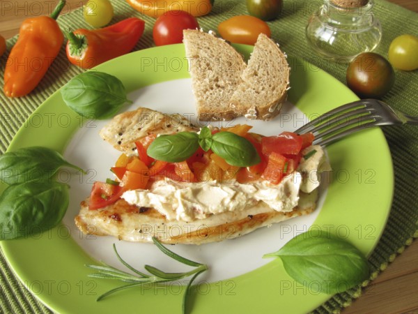 Cream cheese and tomato and pepper salsa on turkey escalope