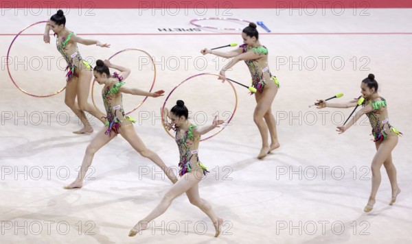 Sofia, Bulgaria - 27 March, 2021: Team Turkey perform during the 3 Hoops + 2 pairs of Clubs group qualifications at the 2021 Rhythmic Gymnastics Sofia World Cup, Sofia, Bulgaria, Europe