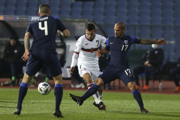 Sofia, Bulgaria - 15 November, 2020: Bulgaria's Dominic Yankov (C)in action with Finland's Nikolai Alho (R) during the UEFA Nations League group stage, League B, Group 4 match between Bulgaria and Finland, Sofia, Bulgaria, Europe