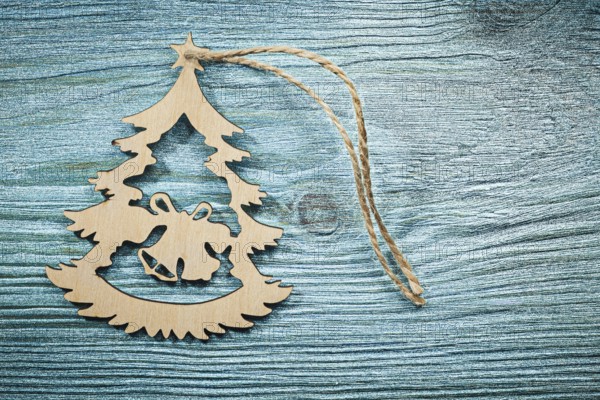 Vintage wooden Christmas toy string on wood board top view celebrations concept