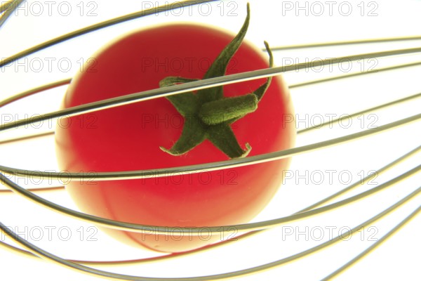 Cocktail tomato in a whisk