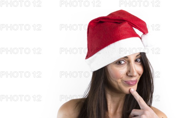 Beautiful female model, with brown hair, wear santa hat. Isolated over a white background