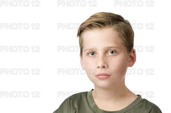 Head-and-shoulders portrait of a young male teenager in a T-shirt looking at the camera against a white background