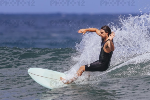 BELLS BEACH, AUSTRALIA, JANUARY 26 2024: Surfers in action at the iconic Bells Beach on a warm summer's afternoon near Torquay, Victoria, Australia, Oceania