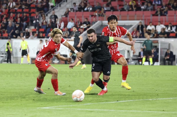 Strong in duels and dangerous in goals: Ritsu Doan (SC Freiburg) with Wooyeong Jeong Woo-Yeong Jeong (SC Freiburg) stops Qara Qarayev (Qarabag Agdam Azerbaijan in the match of the European Football League 2022/23: Matchday 1, SC Freiburg vs Qarabag Agdam