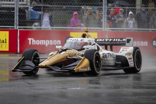 INDYCAR Series driver, RINUS VEEKAY (21) of Hoofddorp, Netherlands, travels through the turns during a wet and dangerous practice session for the Big Machine Music City Grand Prix at Streets of Nashville in Nashville TN