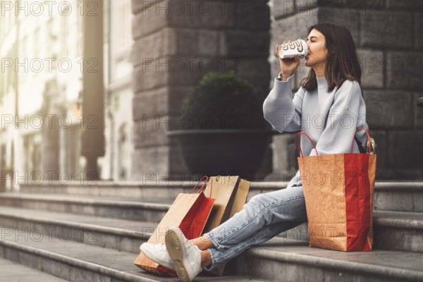 Two young caucasian women having fun on city street outdoors, Best friends enjoying a holiday day out together, Happy lifestyle, youth and young females concept.