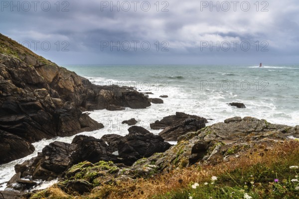Scenic view of cliffs and sea against cloudy sky. Pointe Saint Mathieu, Brittany, France, Europe