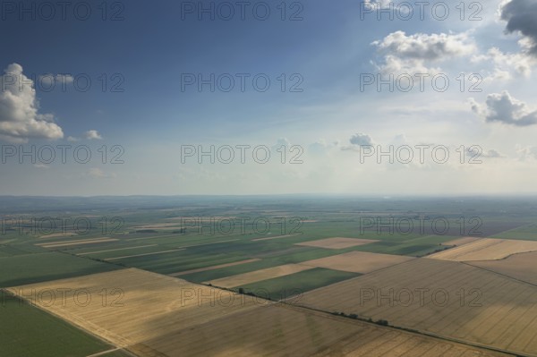 Aerial view of agricultural fields. Cloudy countryside, Aerial view