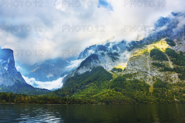 Koenigssee - the cleanest lake in Germany. The lake is surrounded by high mountains. Mountain Lake is a fabulous beauty in Bavaria. The concept of active, ecological and photo tourism