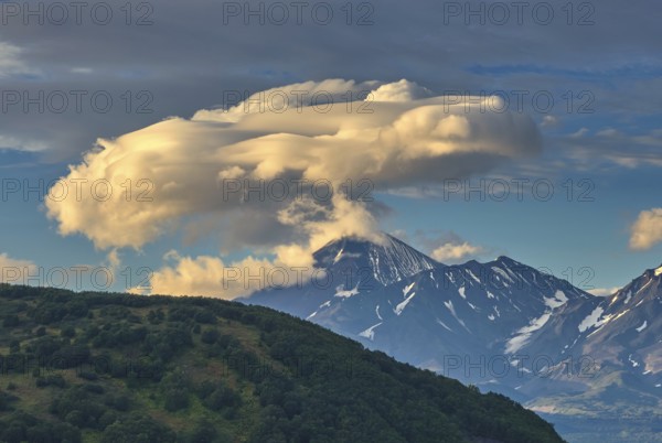 Dramatic spectacular lenticular cloud formation over volcano on Kamchatka peninsula, Russia, Europe
