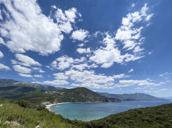 Blue bay in a valley between high mountains.