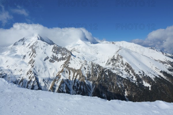 Tops of Pirin mountains view from top of cable car, ski resort Bansko, Bulgaria.