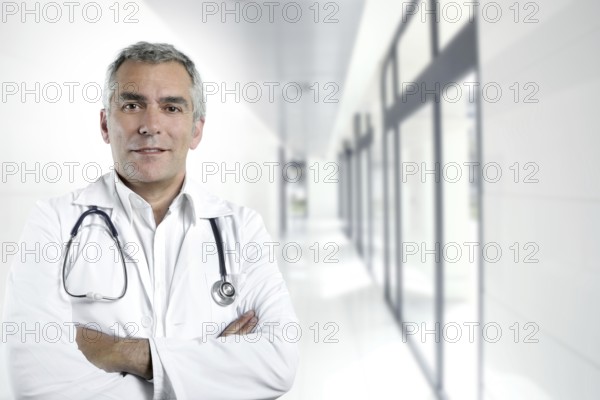 Gray hair expertise handsome senior doctor hospital portrait white corridor