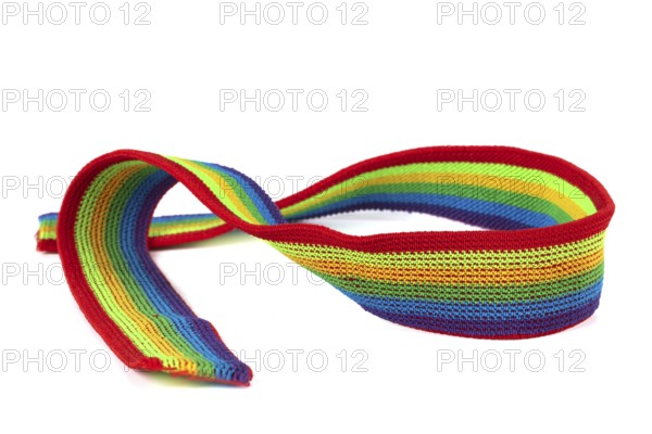 Colourful rainbow ribbon closeup isolated on white background. Colourful LGBT design. Curly, fluttering ribbon