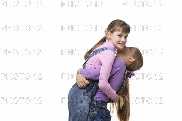 Girl lifted and hugged another a girl