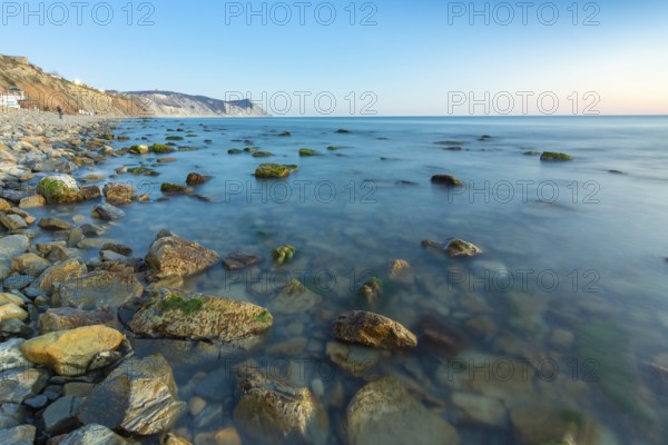Stony sea beach of the 40th anniversary of the victory of the high coast of Anapa at sunset, Black Sea, Anapa, Russia, Europe