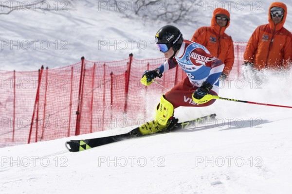 MOROZNAYA MOUNT, KAMCHATKA PENINSULA, RUSSIA, MAR 29, 2019: Mount skier Dmitry Pyshkin Sakhalin skiing down. Russian Alpine Skiing Championship, International Ski Federation Championship, slalom