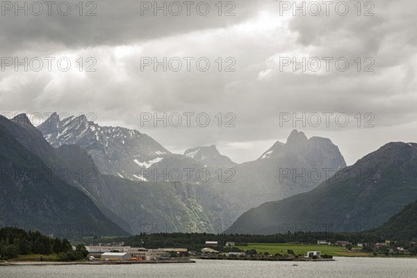 Andalsnes and mountains along the Romsdalsfjorden under a cloudy sky, Norway, Europe