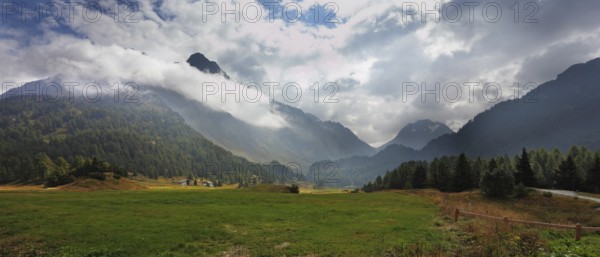 Wonderful valley in the mountains of northern Italy. The cloudy autumn day
