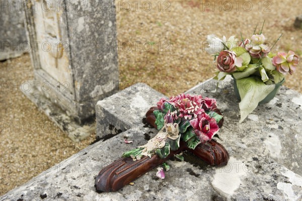 Very old stone graves with moss at the cemetery