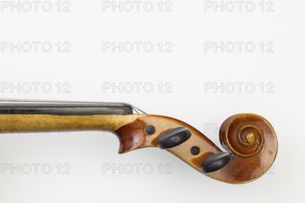 Top view close up shot of old violin on the white table. Flat Lay Image
