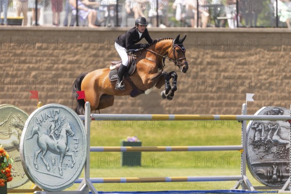 Darragh Kenney of Ireland and riding Eddy Blue, compete in the 1.60m Grand Prix during The Continental international competition at Spruce Meadows, in Calgary, Canada, North America