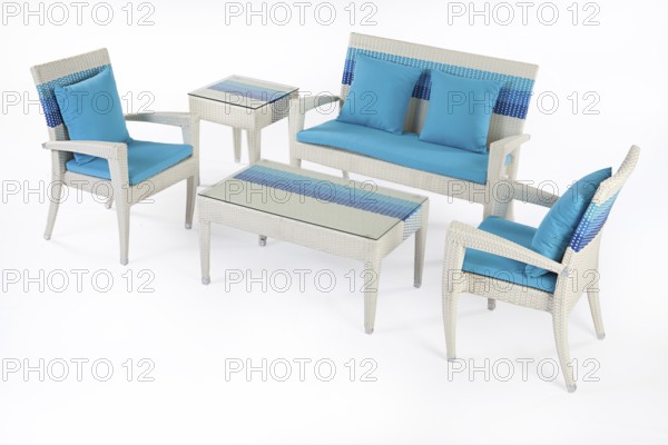 Suite of wicker furniture made of synthetic fibre on isolated background